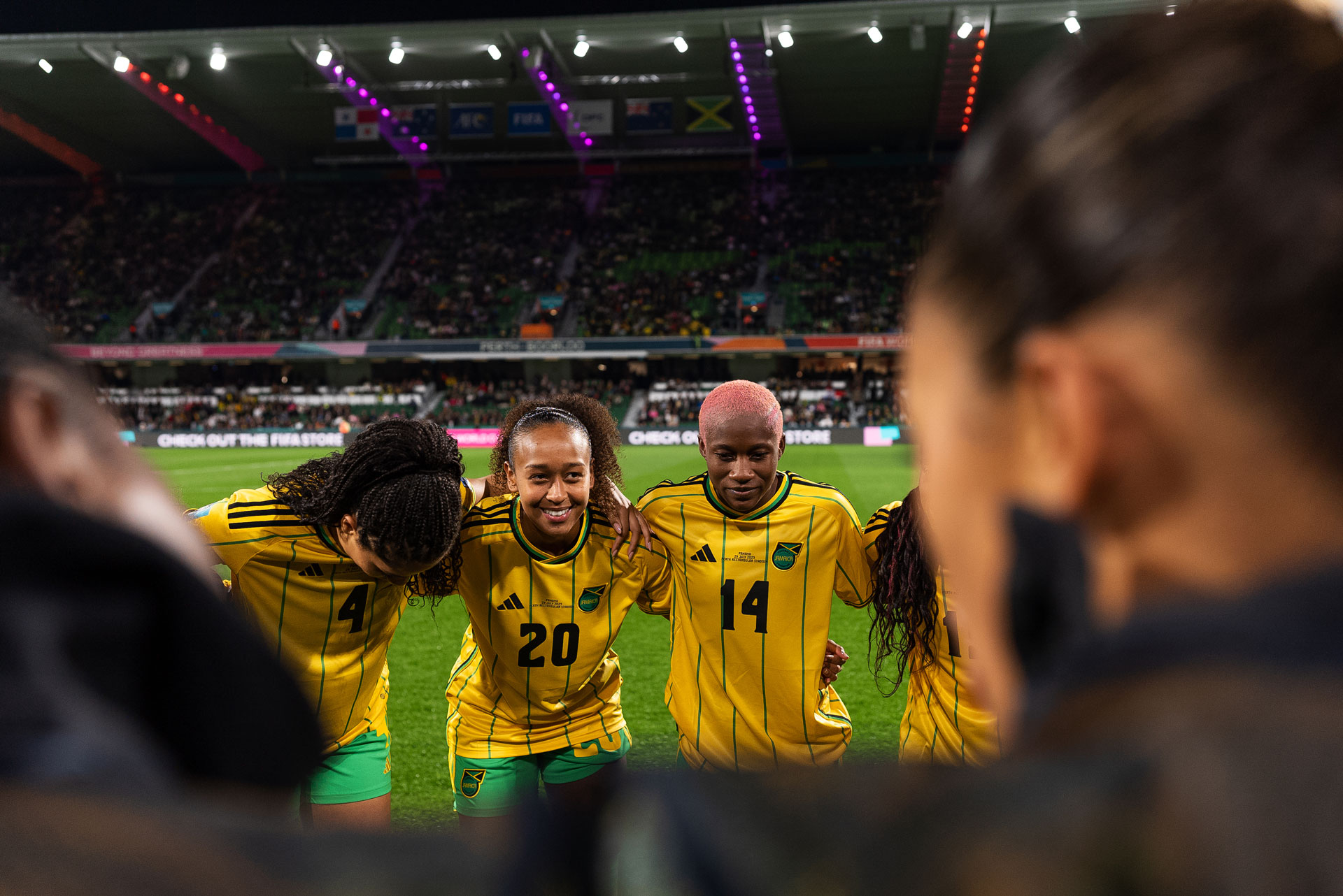 Deneshia Blackwood and Atlanta Primus in the Jamaican team huddle