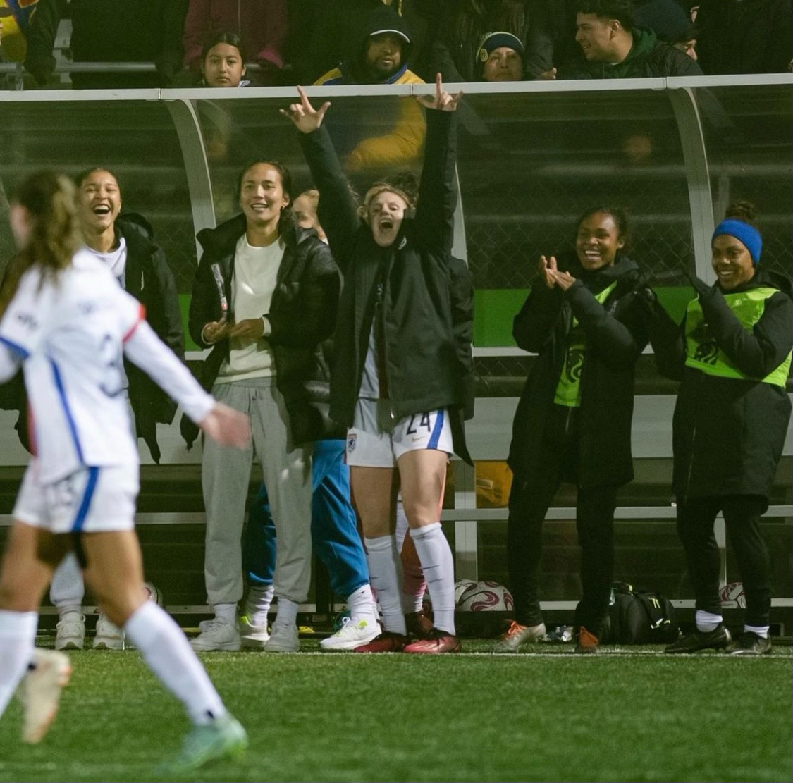 Mariah Lee cheering on her teammates at OLY Town