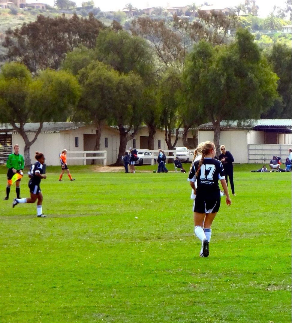 Mariah Lee and Jenna Holtz playing youth soccer