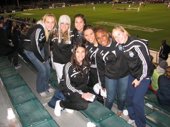 Mariah Lee and Jenna Holtz with teammates at a soccer match